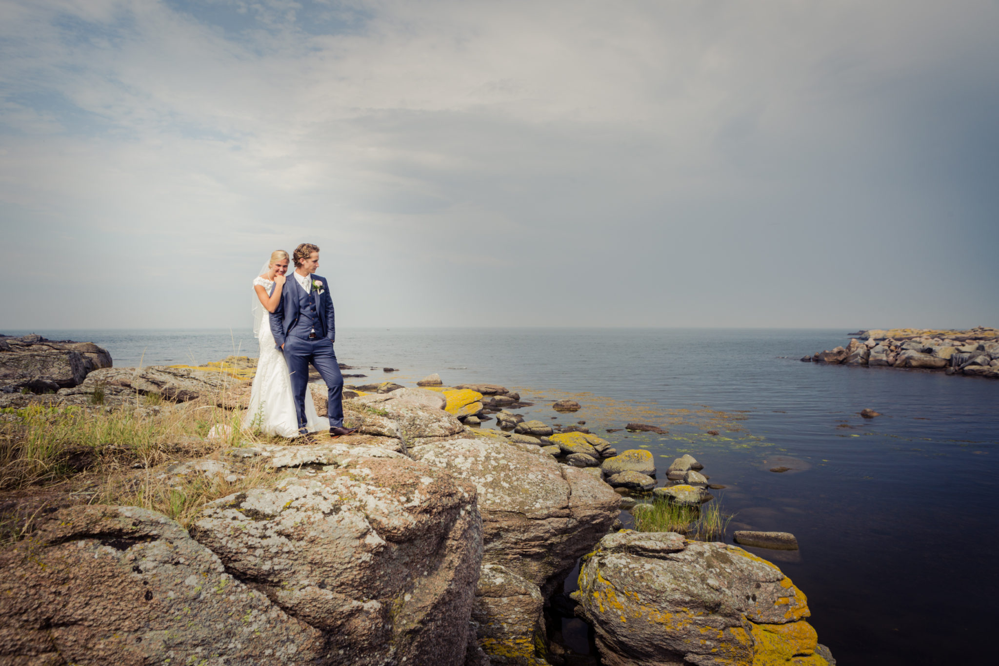 Bridal couples on the rocks on Bornholm in Denmark