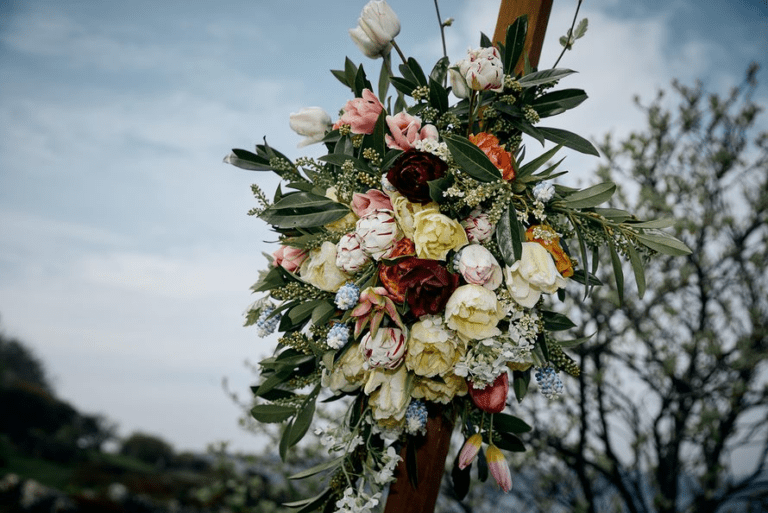 Floral decorations pinned to a wedding arbor on Bornholm.