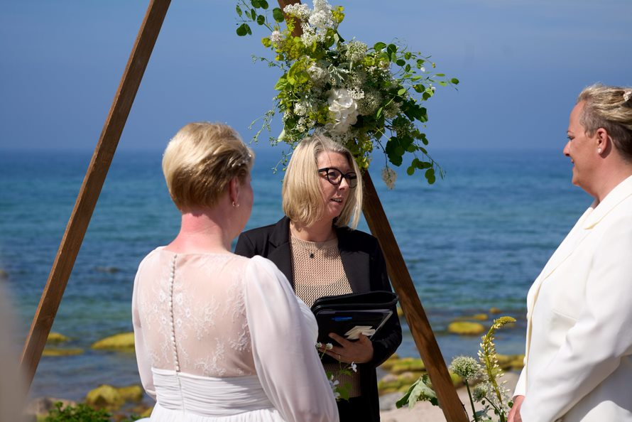 A Danish wedding registrar performs the wedding ceremony in German language for a lesbian couple on Bornholm.