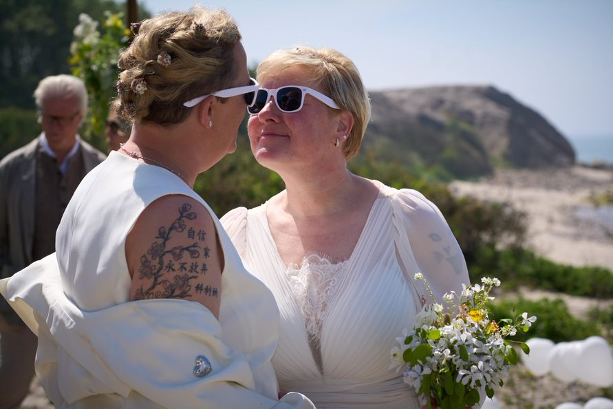 The "you can kiss the bride" moment photographed during a same sex wedding ceremony on Bornholm in Denmark.