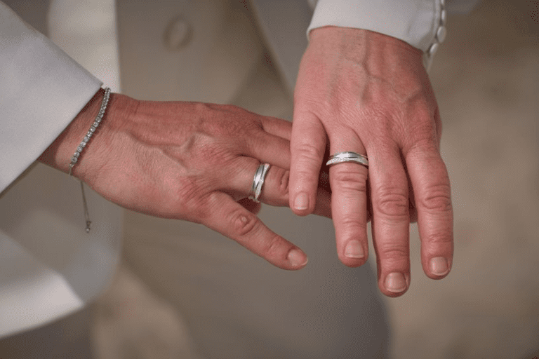 A newly wed German same sex couple is showing off the wedding bands after the wedding ceremony on Bornholm in Denmark.