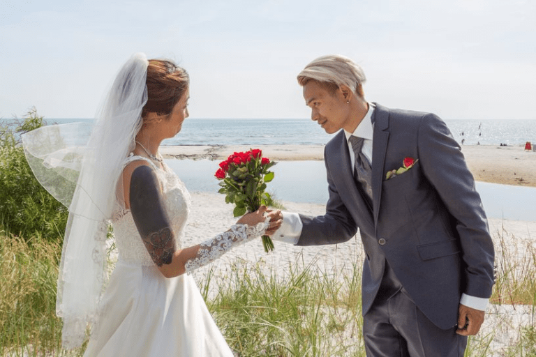 Wedding photograph of an Asian couple getting married on Bornholm in Denmark, with the help of a wedding planner.