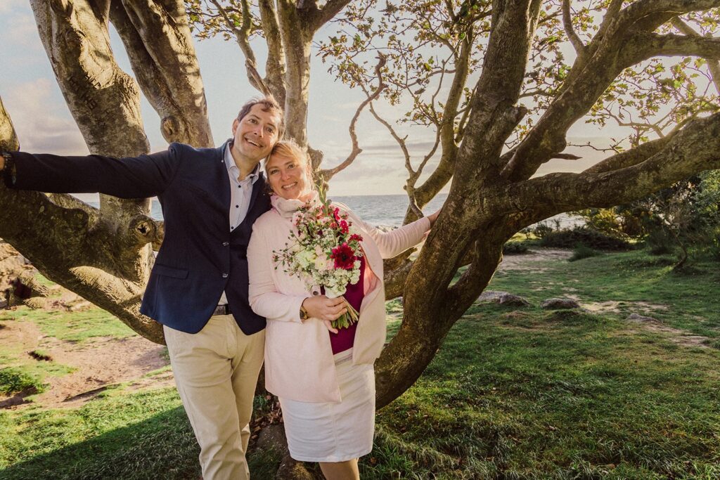 A just married couple with a tree close to Salomon's Chapel on Bornholm.