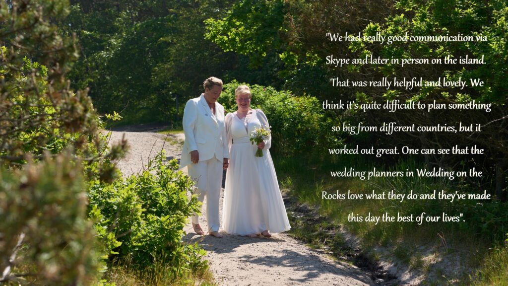 A lesbian couple to be married walks down an aisle in the Danish nature on the island of Bornholm.