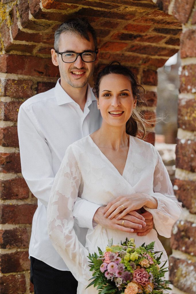A beautiful newly-wed couple among the historic ruins of Hammerhus on Bornholm.
