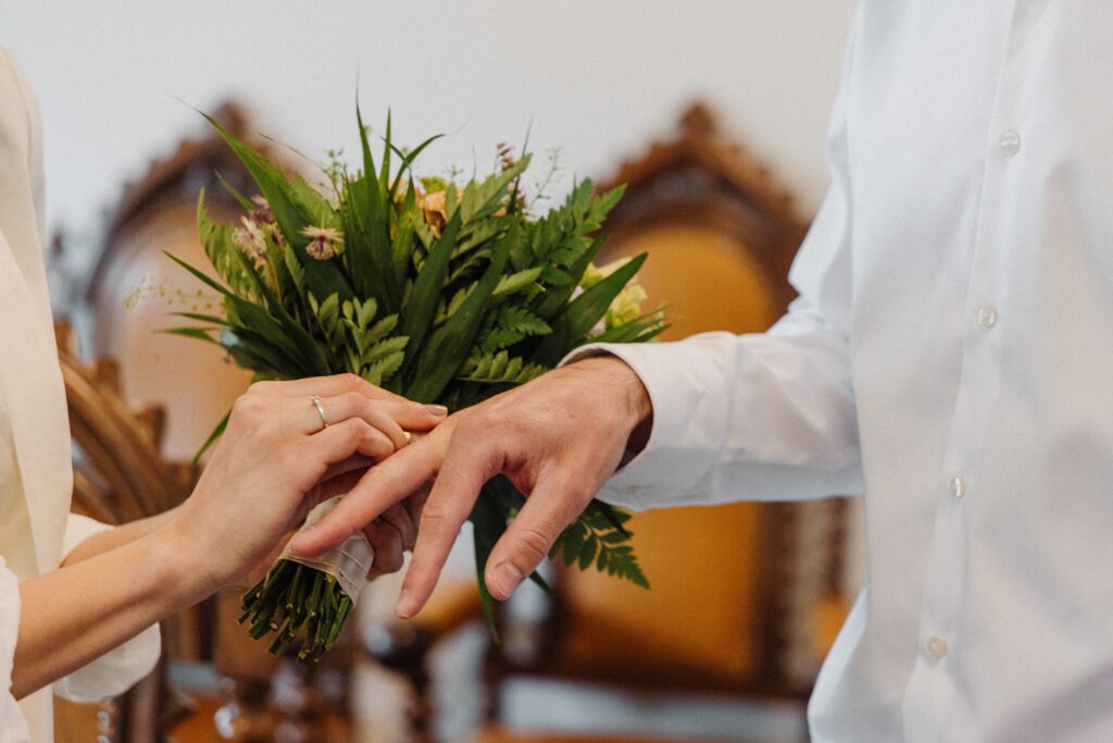 A couple about to be wed exchanges rings during a wedding ceremony on Bornholm in Denmark.