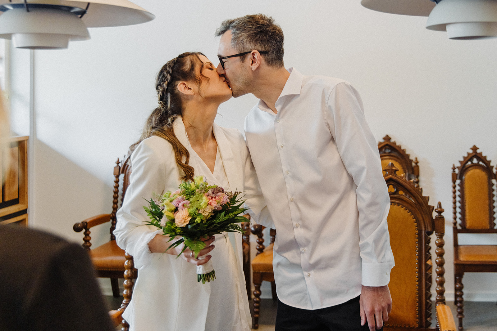 A couple kisses after the Danish registrar in the registry office of Rønne on Bornholm proclaims them to be man and wife.