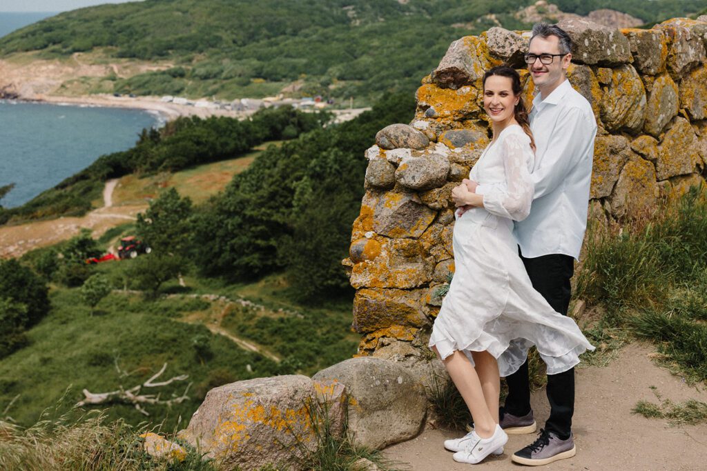 A newly-wed couple poses at the historic walls of Hammershus Castle on Bornholm.