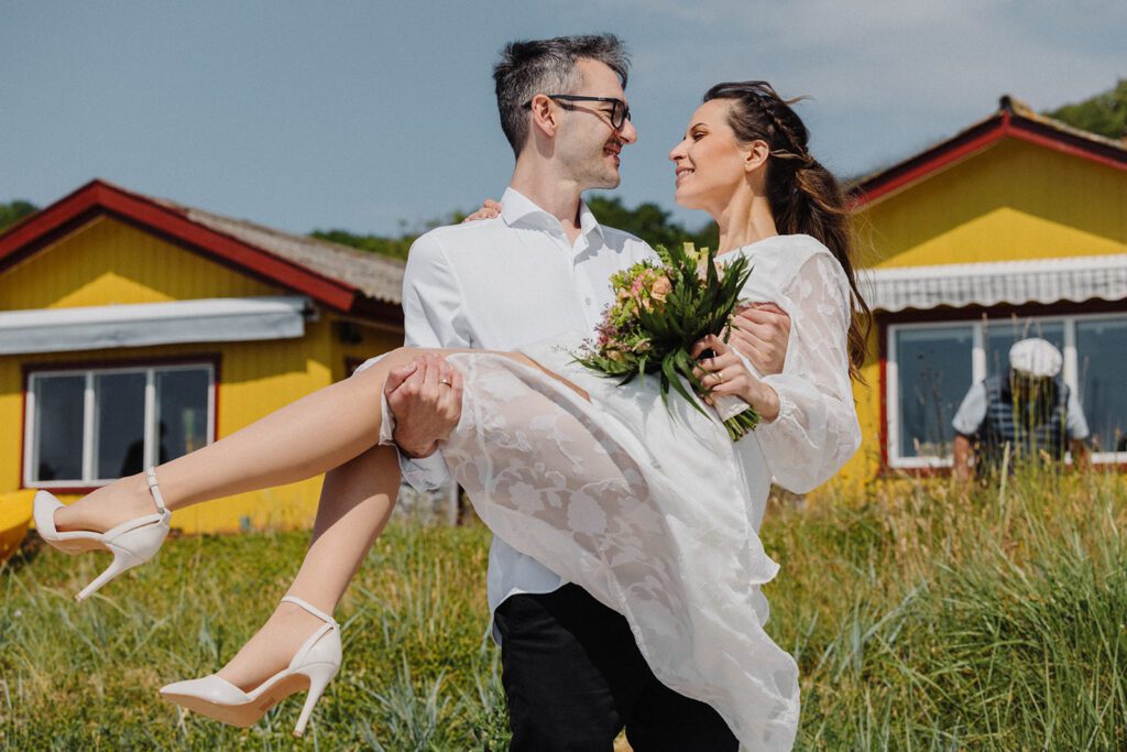A Danish sea captain photobombs the wedding photo of a newly-wed Bulgarian couple on Bornholm.