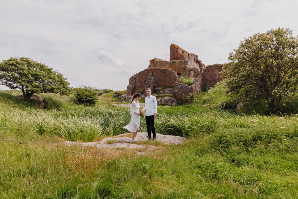 A newly-wed couple outside the ruin of Hammerhus castle on Bornholm in Denmark.