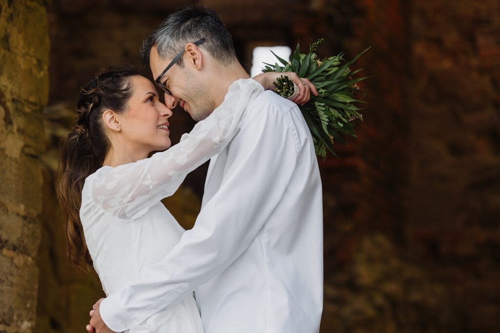 A newly-wed couple poses among the ruins of the historic site of Hammershus Castle on Bornholm in Denmark.