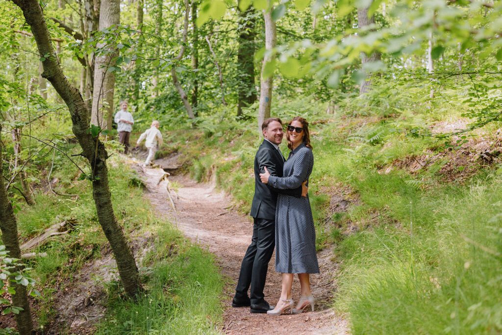 A newlywed bride and groom in the Danish woods after their wedding in the registry office on Bornholm.