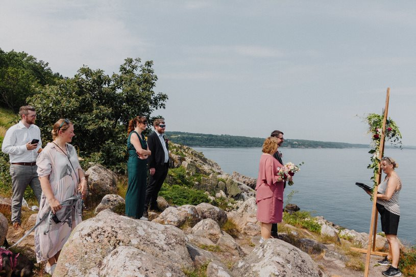 A newly-wed couple looks out over the sea on Bornholm in Denmark.