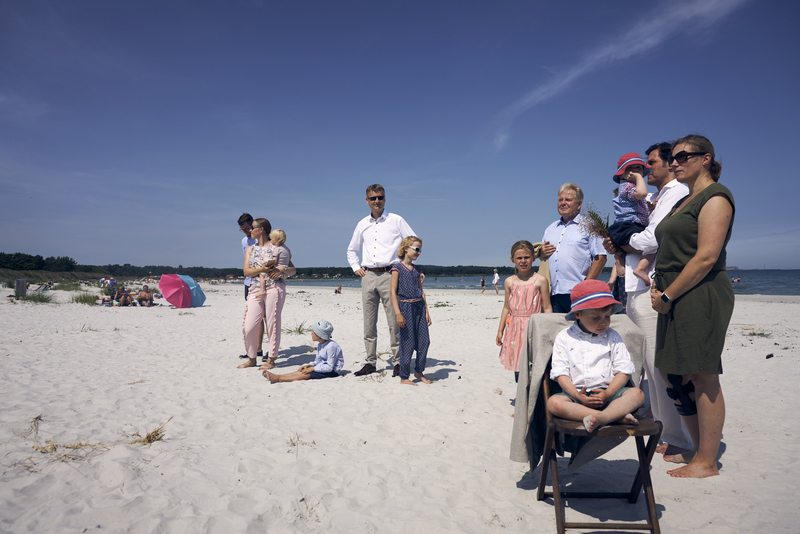 Wedding party with children awaiting the bridal couple during a beach wedding on Bornholm.