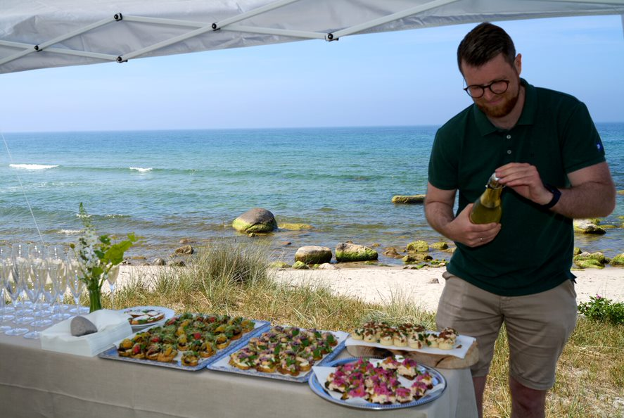 A Danish wedding planner prepares the wedding buffet for the arrival of the wedding guests.