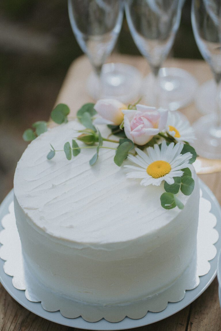 A small wedding cake with floral decorations in Denmark.